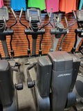  Life Fitness 95X commercial elliptical crosstrainer featuring the Discover SI touchscreen console, multi-grip handlebars, and oversized foot pedals.