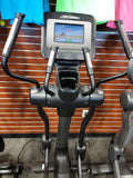 Detailed close-up of the 10-inch Life Fitness Discover SI integrated LCD touchscreen console interface showing digital workout metrics, quick start buttons, and media connectivity ports
