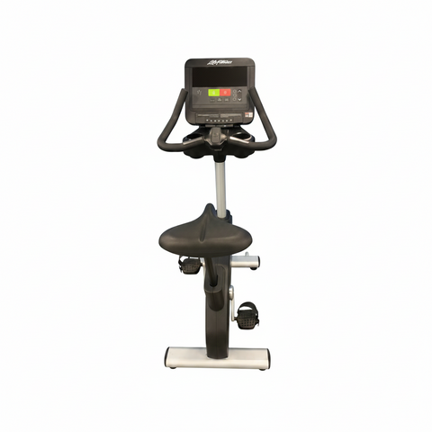 Remanufactured Life Fitness Integrity Series commercial upright stationary bike with a silver frame, Comfort Curve seat, and racing handlebars.